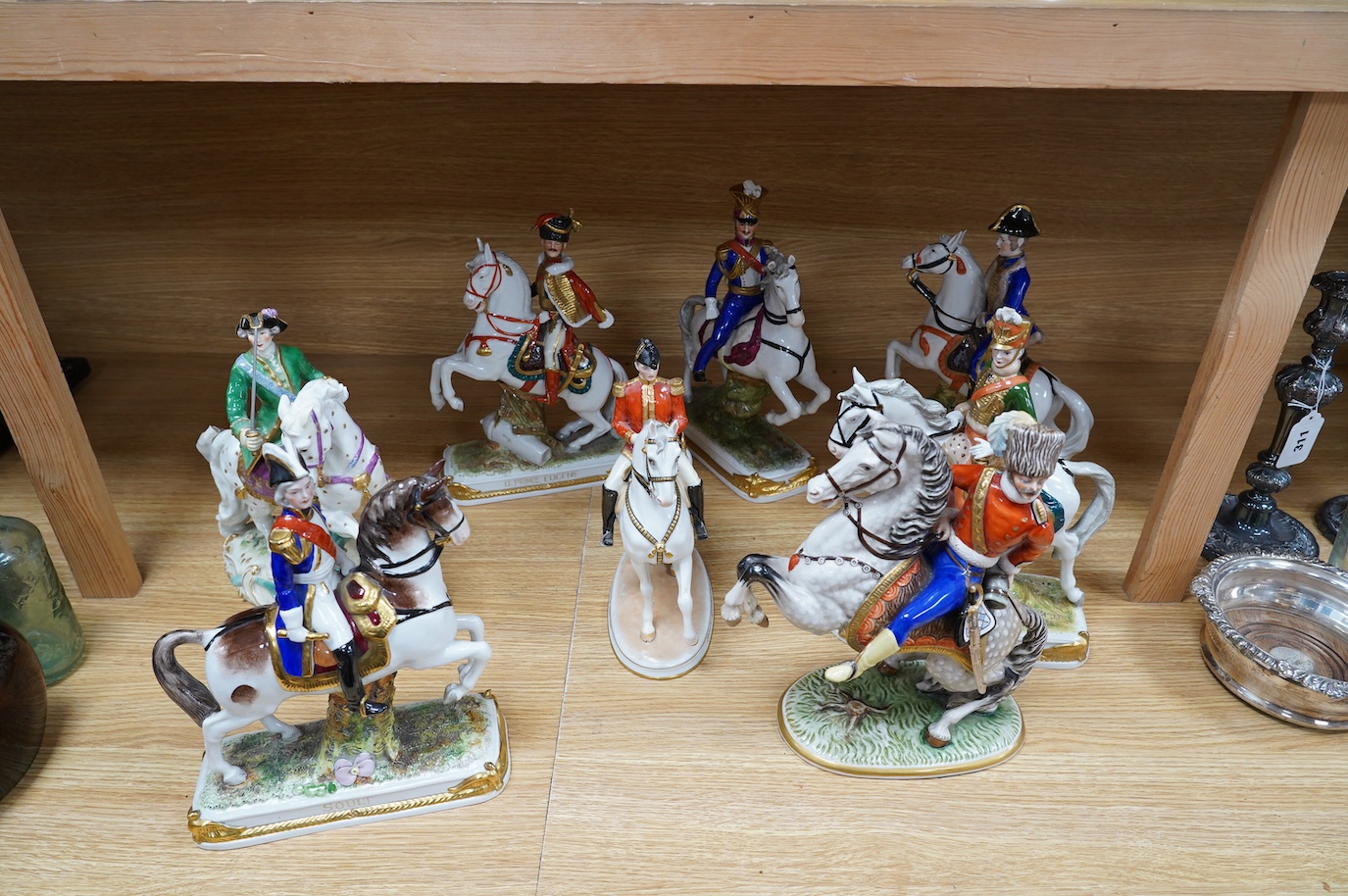 A group of eight Italian porcelain figures on horseback, tallest 30cm. Condition - fair